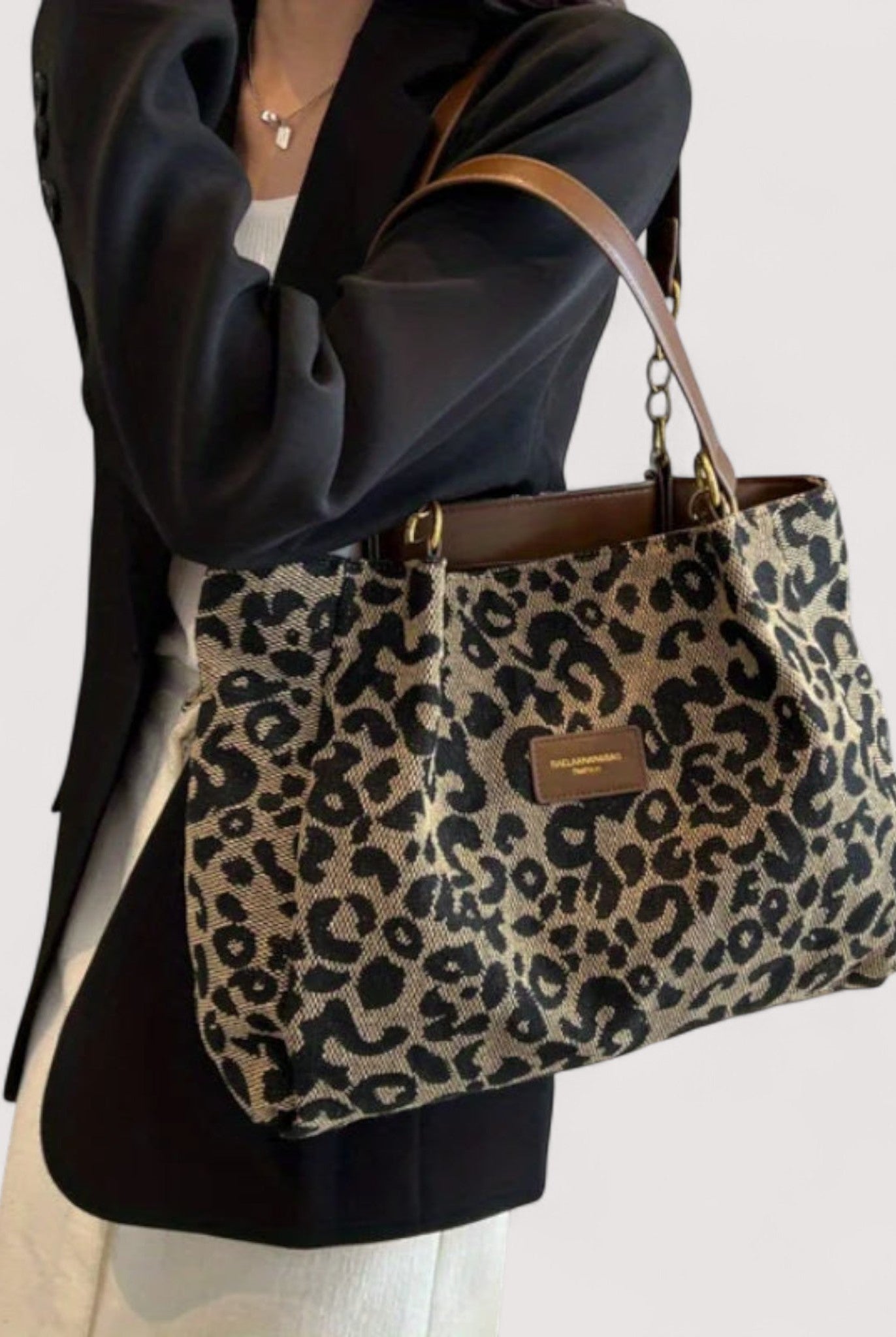 Lumina Wear Victoria leopard print canvas shopping bag with sturdy handles and spacious interior, stylish and functional.