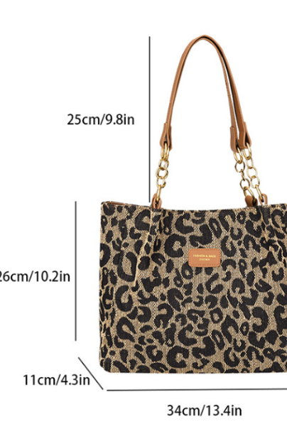 Victoria leopard print canvas shopping bag by Lumina Wear, stylish tote with bold animal print and sturdy handles.
