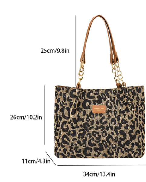 Victoria Leopard Print Canvas Shopping Bag by Lumina Wear, stylish handbag with bold leopard pattern and sturdy handles.
