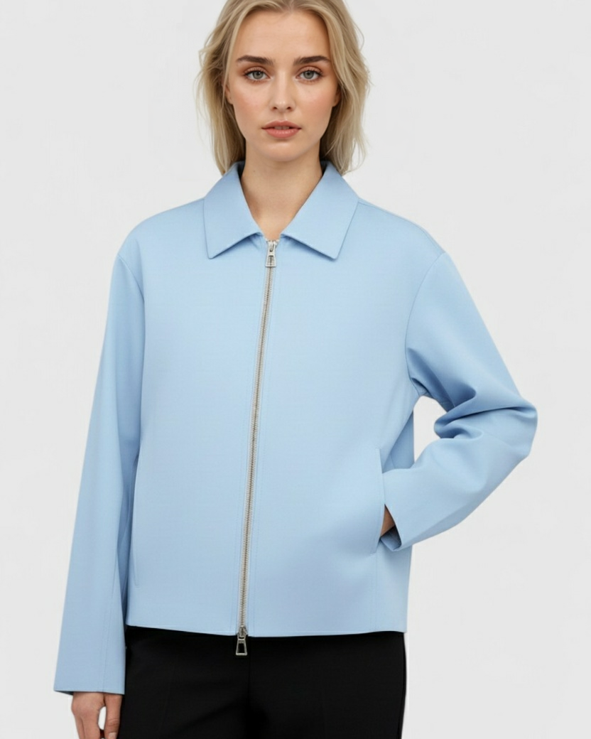Light blue Lumina Wear Victoria casual bomber jacket with zipper closure, shown on a model, featuring a stylish and relaxed fit.