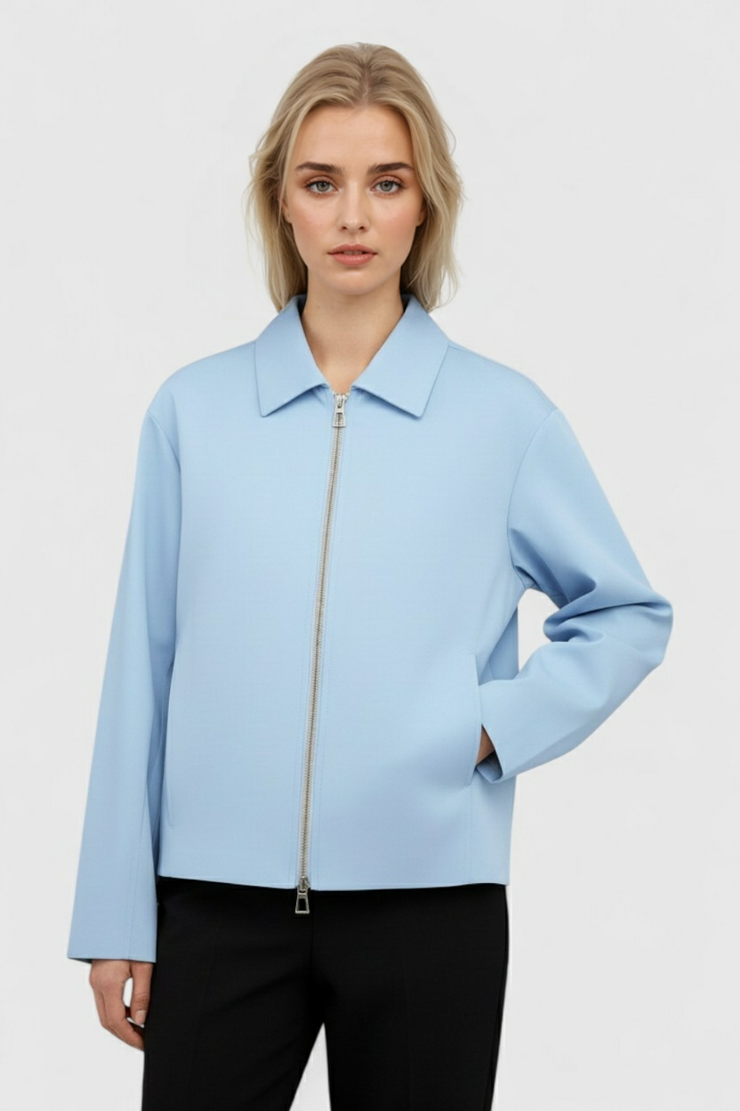 Light blue Victoria bomber jacket by Lumina Wear featuring a zipper closure and casual style, displayed on a plain background.