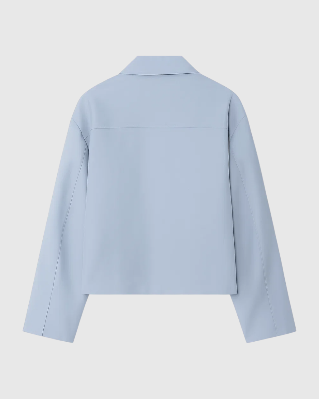 Light blue Lumina Wear Victoria casual bomber jacket with zipper closure, shown on a model with pockets and ribbed cuffs.