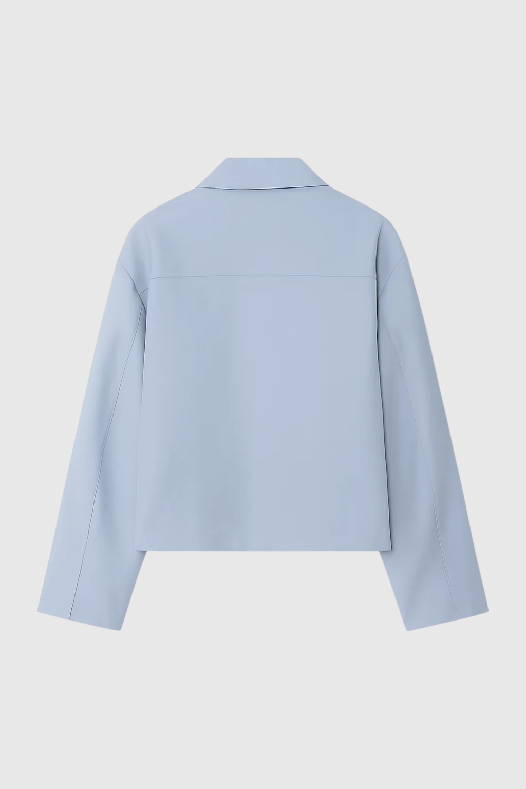 Light blue Victoria Lumina bomber jacket with zipper closure, casual style, shown on a person with pockets and ribbed cuffs.