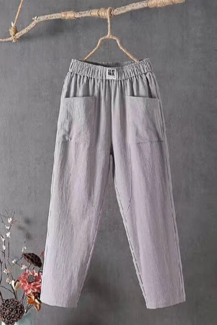 Victoria Lumina white casual trousers with elastic waistband, featuring a relaxed fit and comfortable fabric, shown on a model.