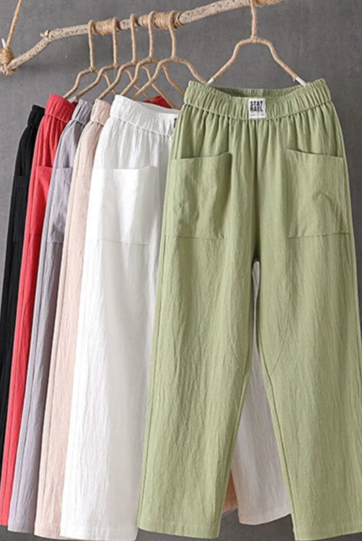 Victoria Lumina casual white trousers with elastic waistband, relaxed fit, soft fabric, and stylish comfort.