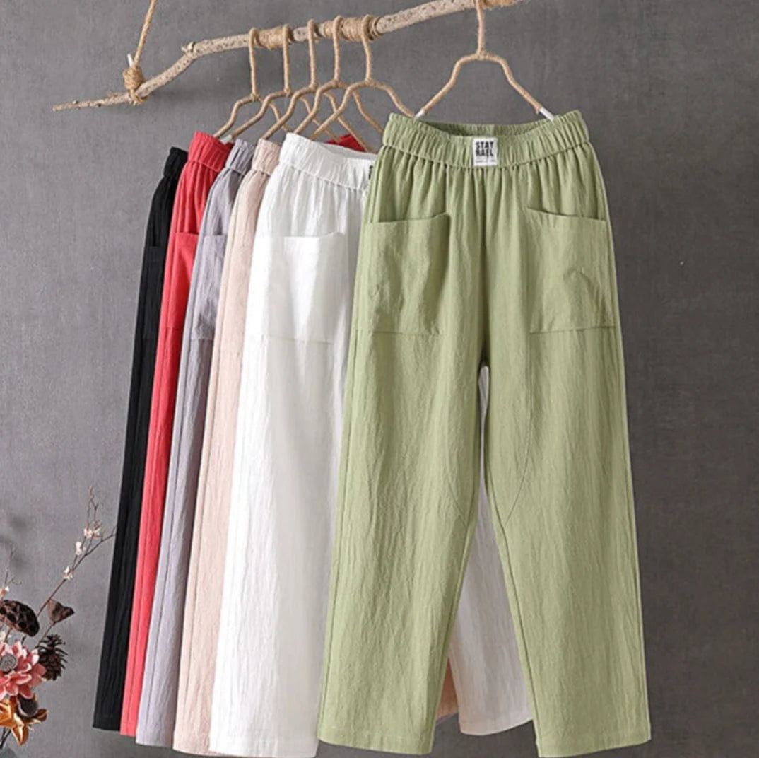 Victoria Lumina casual white trousers with elastic waistband, relaxed fit, soft fabric, and stylish comfort.