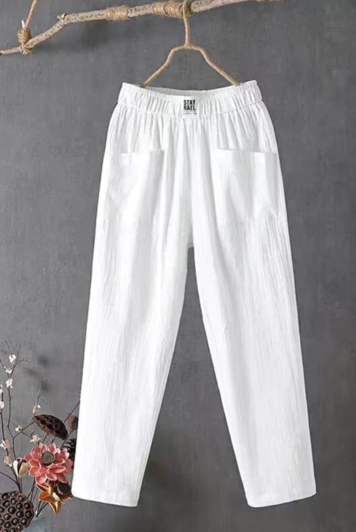 Victoria Lumina white casual trousers with elastic waistband, shown on a model, featuring a relaxed fit and comfortable style.