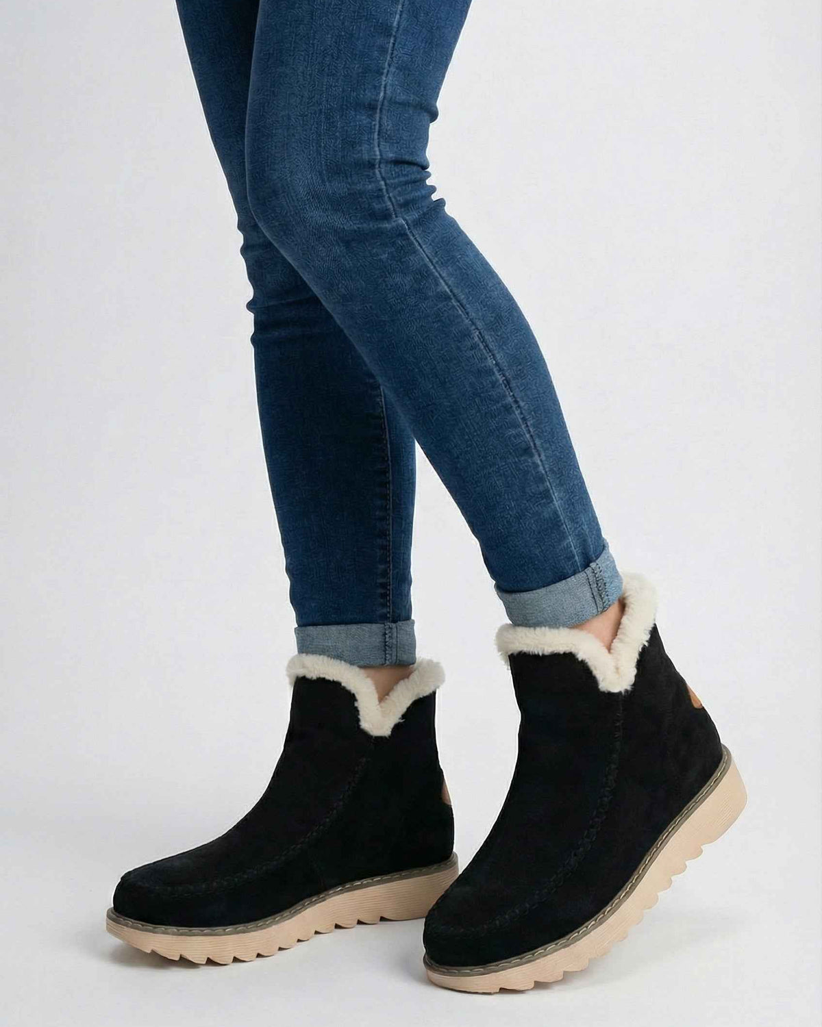 Black Victoria ankle boots by Lumina Wear with warm lining, featuring sleek design and sturdy sole, perfect for stylish winter wear.