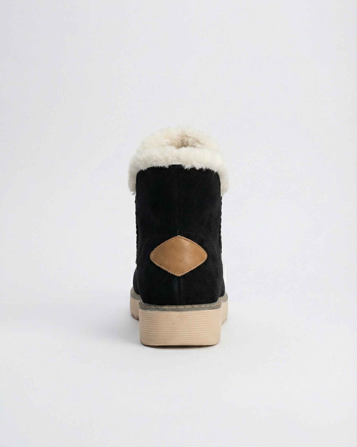 Black Victoria Lumina Wear ankle boots with warm lining, stylish design, and side zipper, perfect for cold weather.