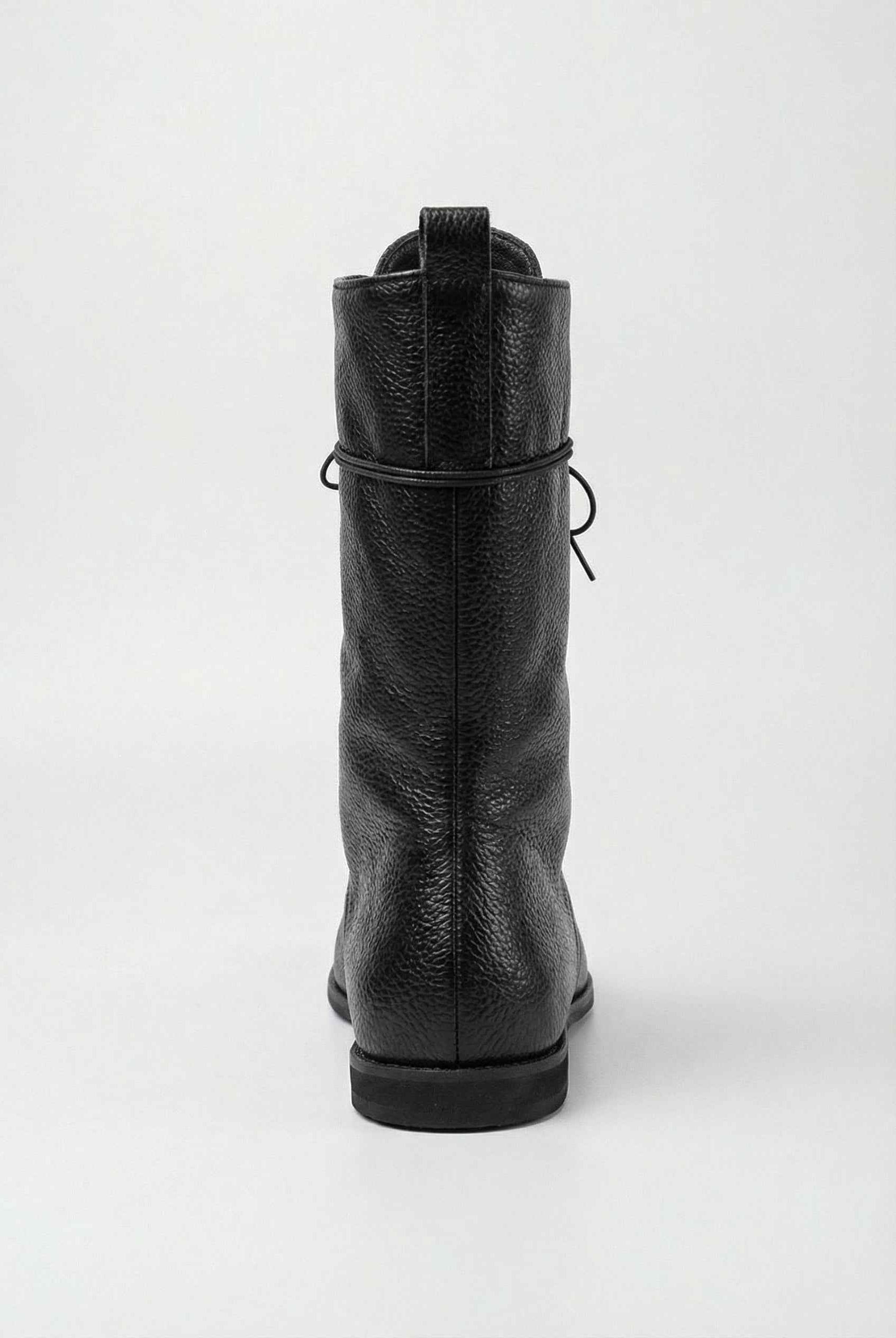 Black lace-up ankle boots with cozy lining from Lumina Wear, stylish women's boots featuring a sleek design and comfortable fit.