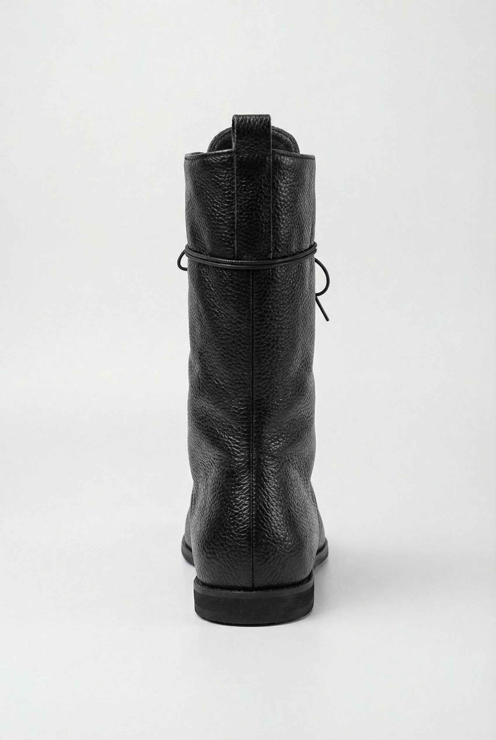 Black lace-up ankle boots with cozy lining from Lumina Wear, stylish women's boots featuring a sleek design and comfortable fit.