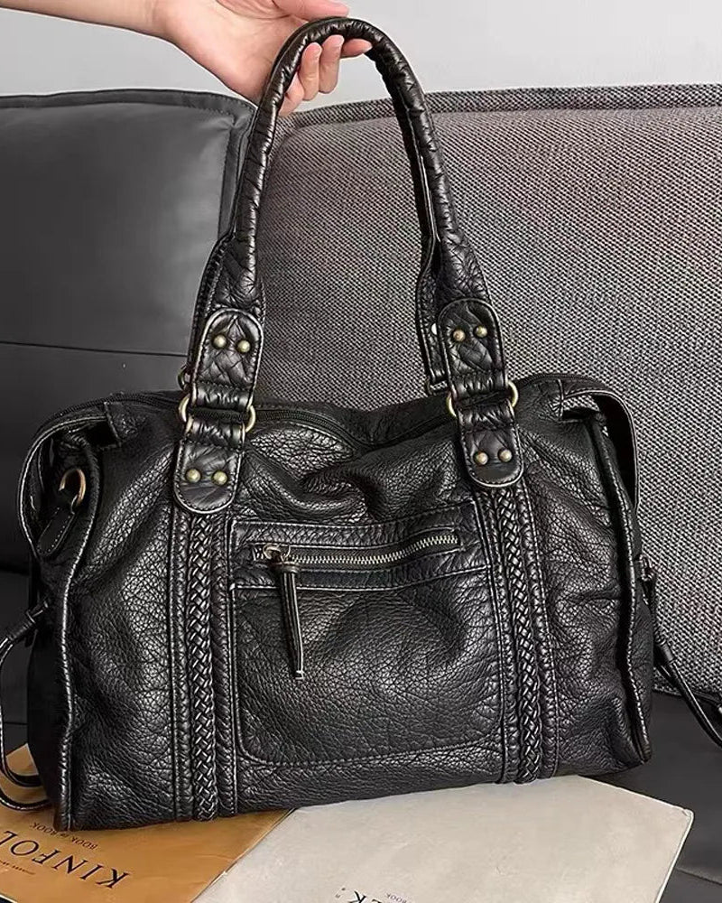 Lumina Wear Victoria black PU leather handbag with multiple pockets, featuring a stylish design and organized interior.