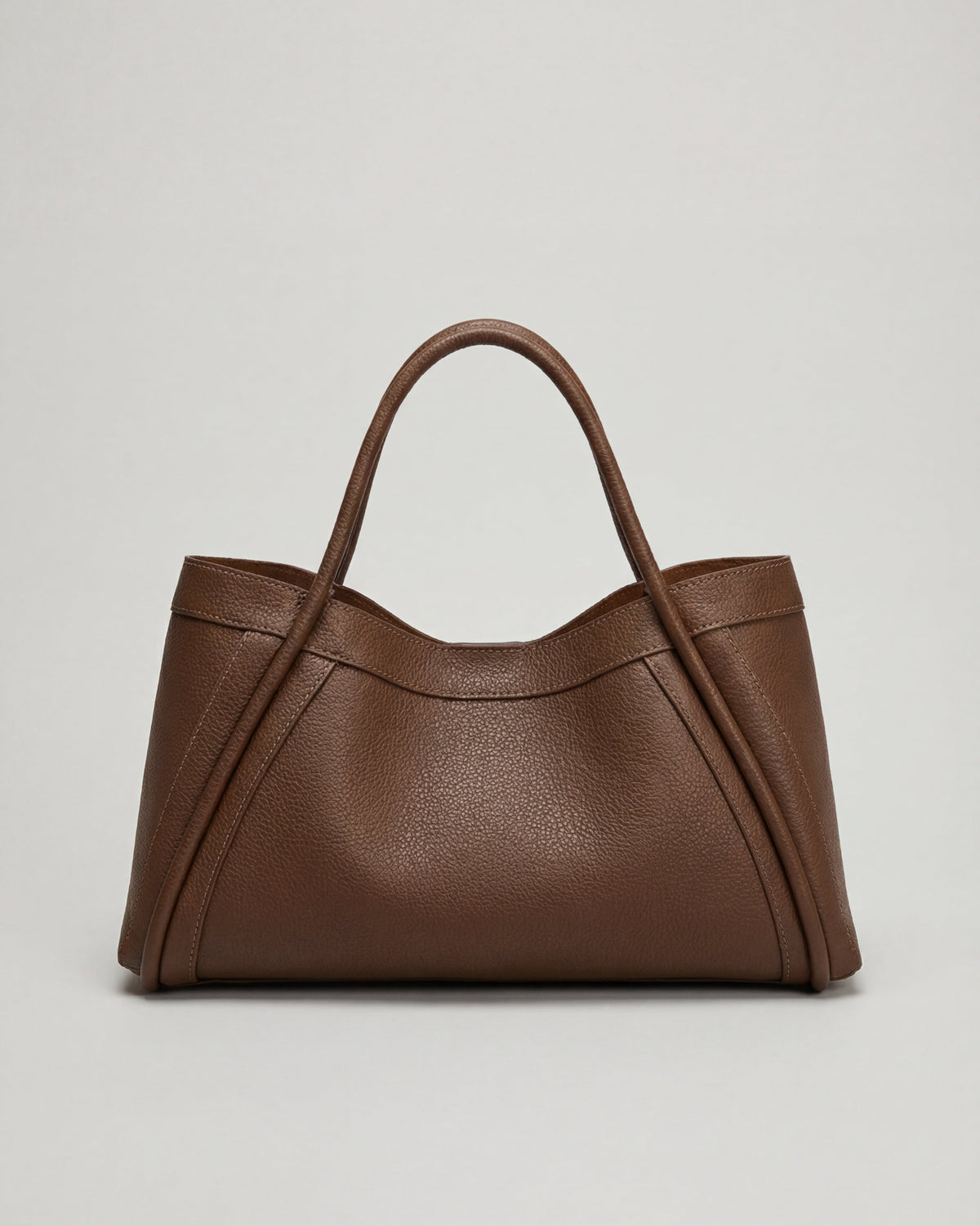 Lumina Wear Victoria black tote handbag with spacious pockets, stylish design, and sturdy handles for everyday use.