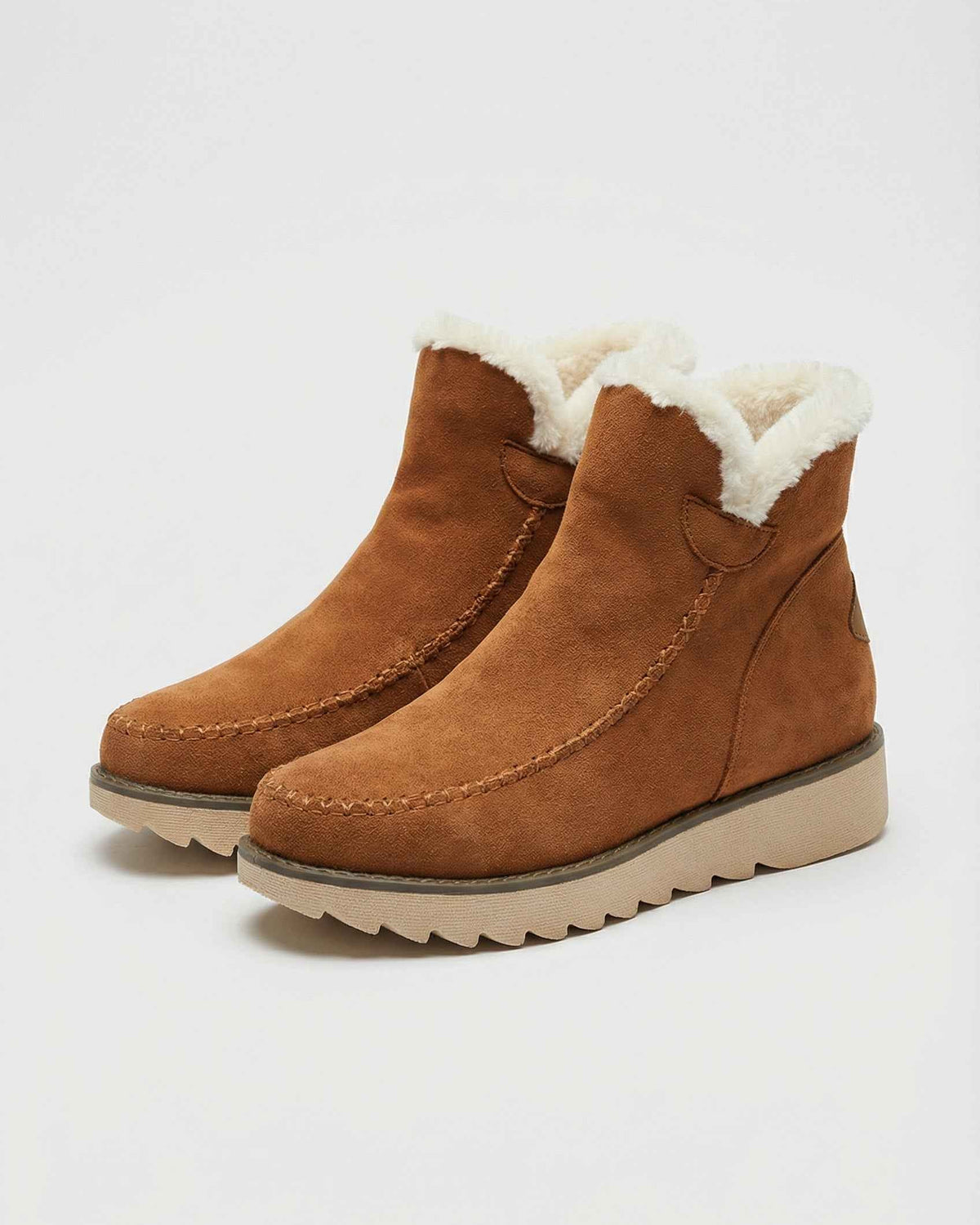 Victoria Lumina brown ankle boots with warm lining, stylish leather footwear featuring a sleek design and comfortable fit.