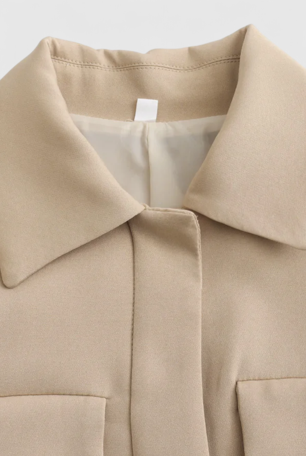 Khaki Victoria Lumina Wear chic cropped button jacket with a flattering fit, styled with long sleeves and front buttons.