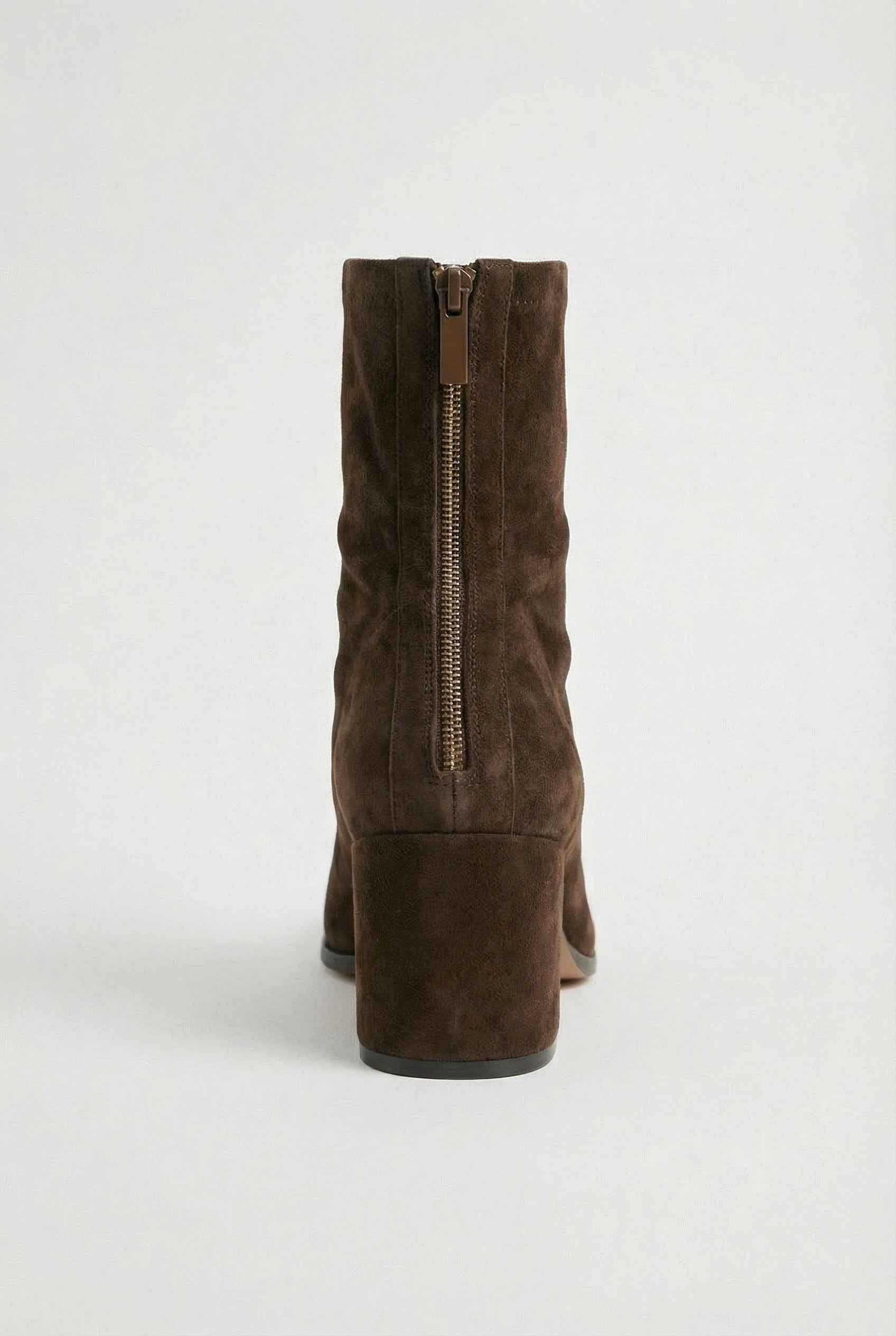 Dark brown women's ankle boots by Lumina with a sleek design and block heel, featuring a chic, modern silhouette.