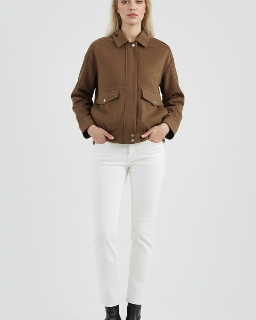 Victoria dark brown suede bomber jacket with zipper closure by Lumina Wear, displayed on a hanger showing its stylish design.