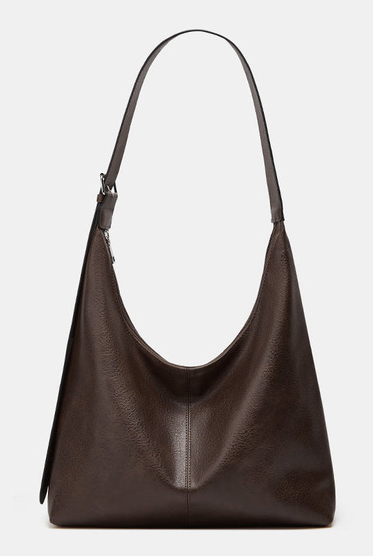Victoria Lumina commuter tote bag in brown with durable construction and ample storage for handbags and purses.