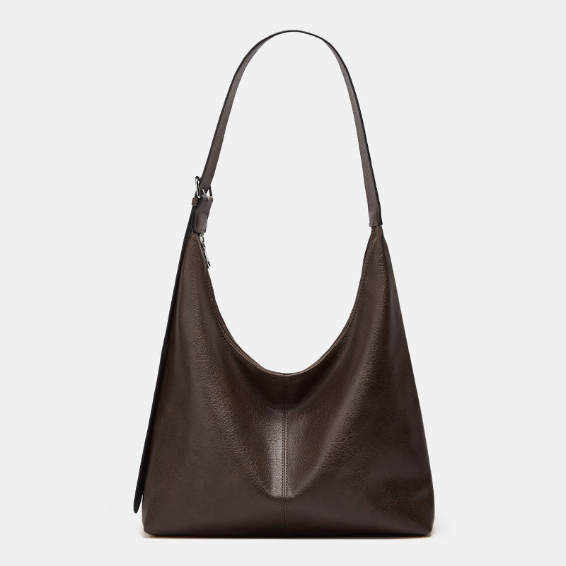 Victoria Lumina commuter tote bag in brown with durable construction and ample storage for handbags and purses.