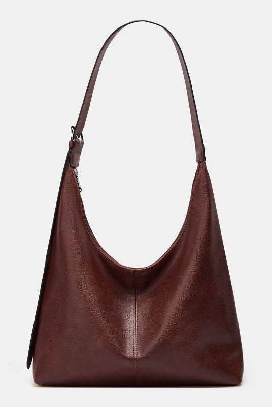 Lumina Wear Victoria commuter tote bag in brown with durable design and ample storage for everyday use.