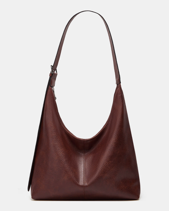 Victoria Lumina commuter tote bag in brown with durable design and ample storage, perfect for everyday use.