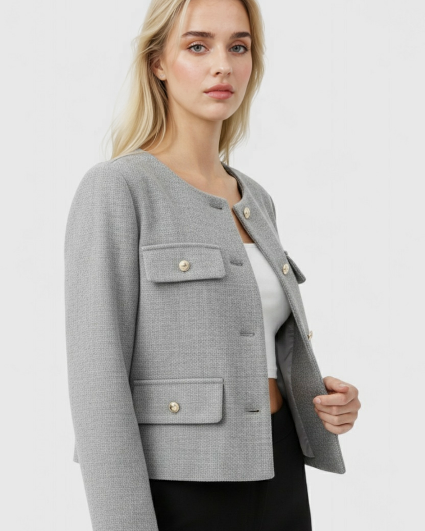 Victoria Lumina gray short jacket with versatile style, featuring a chic design and tailored fit, shown on a model.