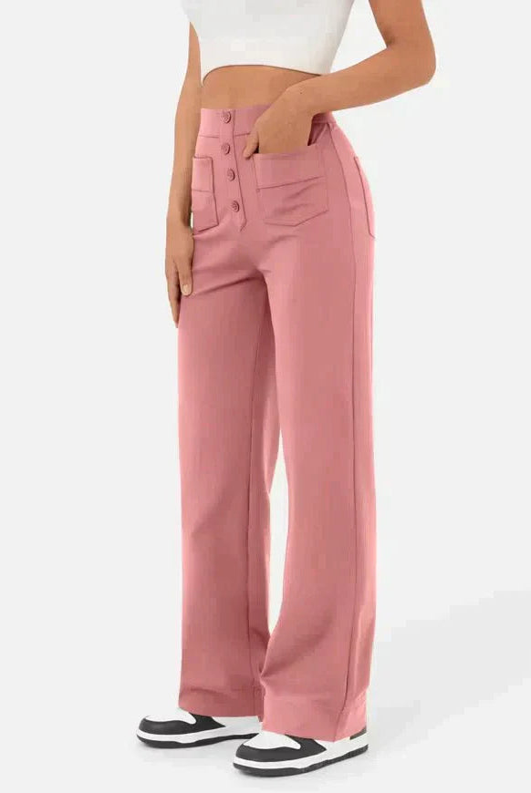 Victoria chic high-waisted trousers by Lumina Wear in stone green with stretch fabric, shown on a model.