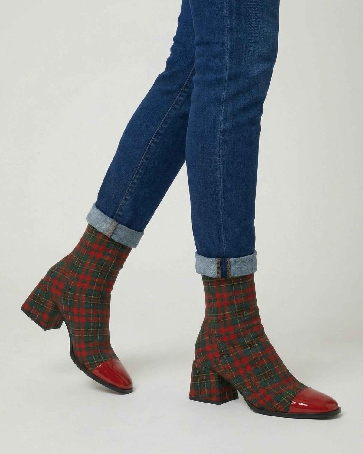 Victoria Lumina mid-calf boots in red and green with a durable sole, showcasing stylish design and sturdy construction.