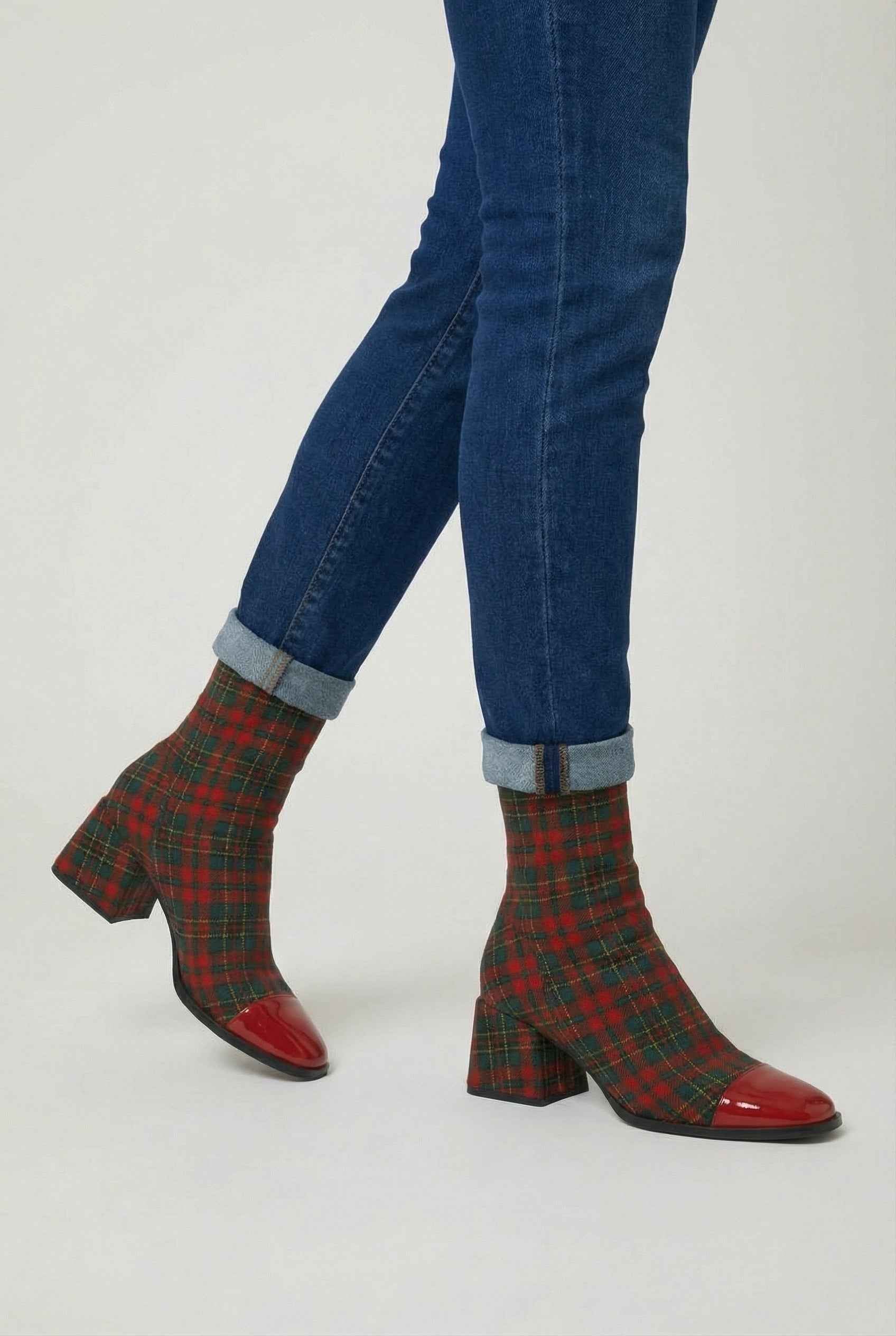 Victoria Lumina mid-calf boots in red and green with a durable sole, showcasing stylish design and sturdy construction.