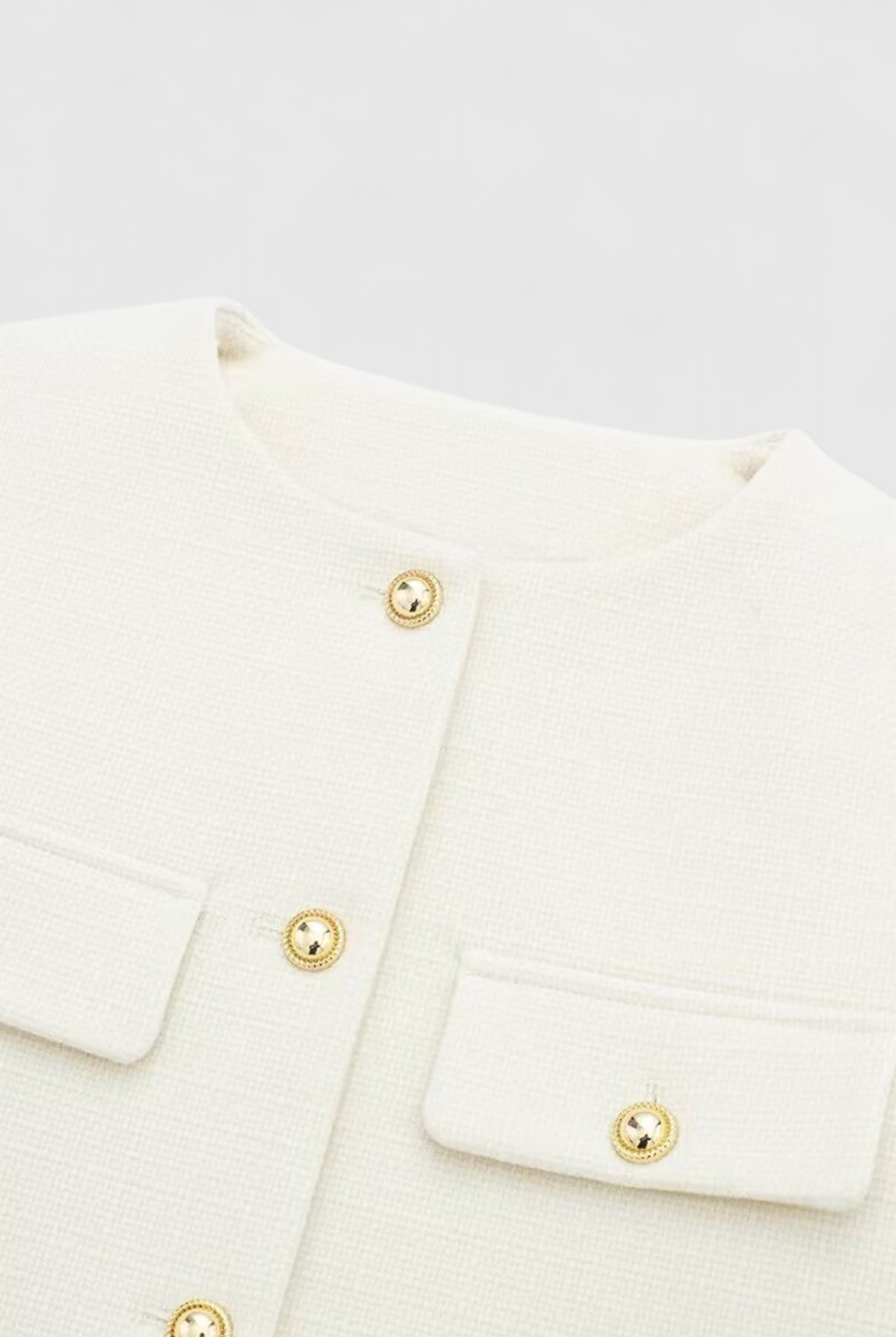 Lumina Wear Victoria white tailored short jacket with versatile style, shown on a model, perfect for chic casual or dressy looks.