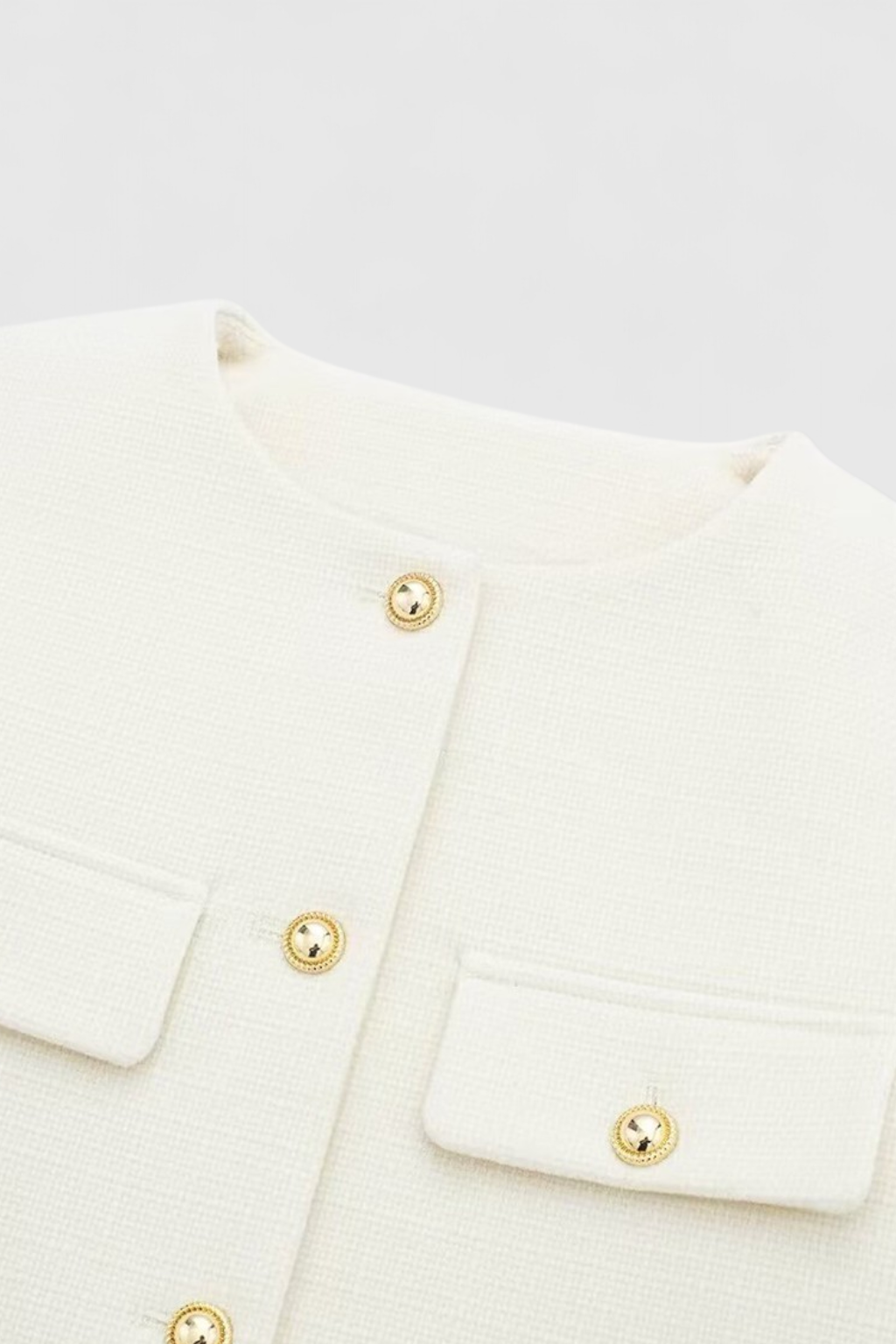 Lumina Wear Victoria white tailored short jacket with versatile style, shown on a model, perfect for chic casual or dressy looks.