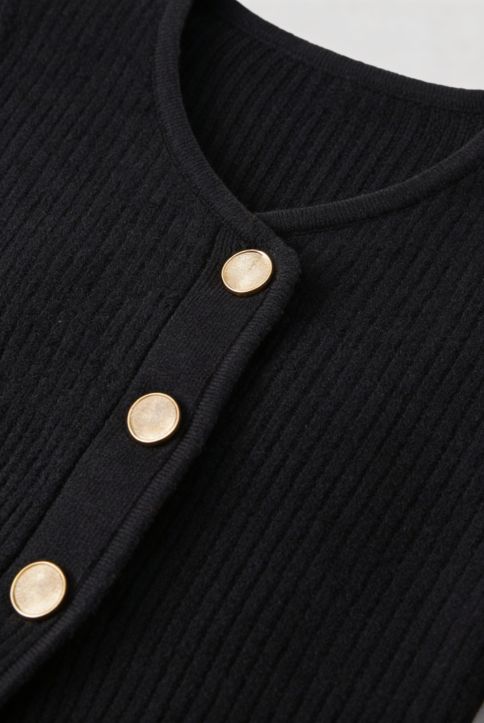 Black knit cardigan for women by Lumina Wear featuring cozy fabric and ribbed details, perfect for layered, casual outfits.