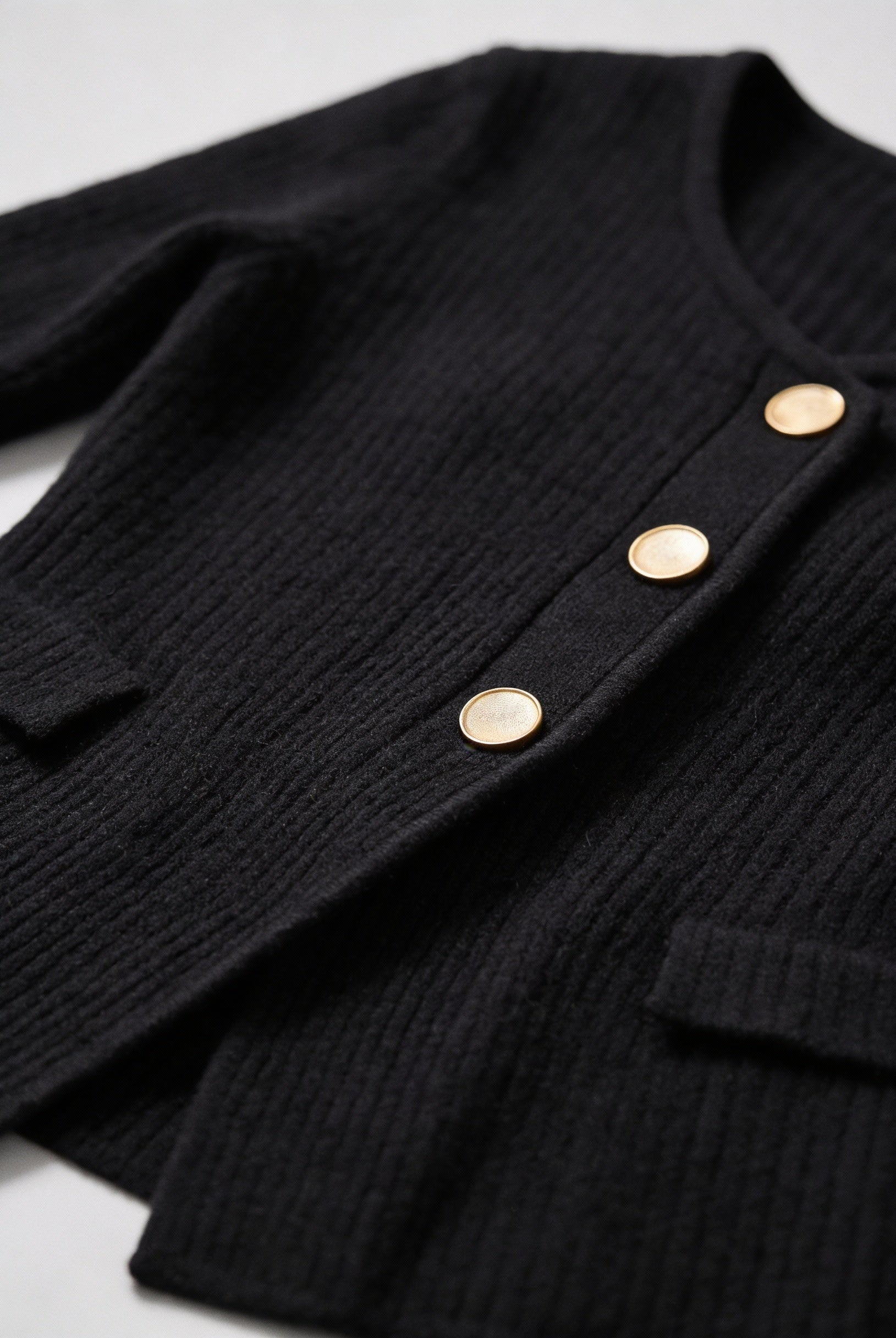 Black knit cardigan for women with ribbed details, from Lumina Wear's Victoria collection. Cozy and stylish women's cardigan.