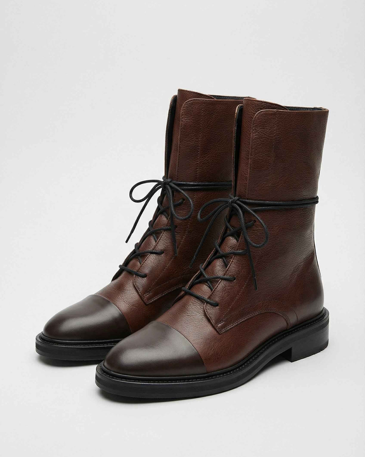 Victoria cozy brown lace-up ankle boots with chic detailing from Lumina Wear, featuring dark brown leather and stylish design.