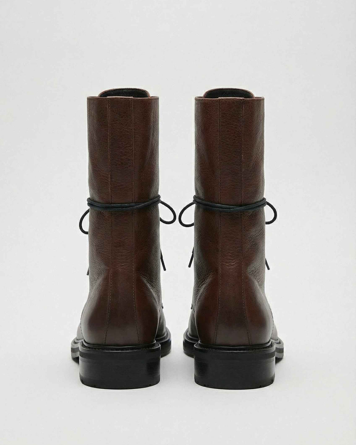 Dark brown Lumina Wear Victoria lace-up ankle boots with chic detailing and cozy design, perfect for stylish casual wear.