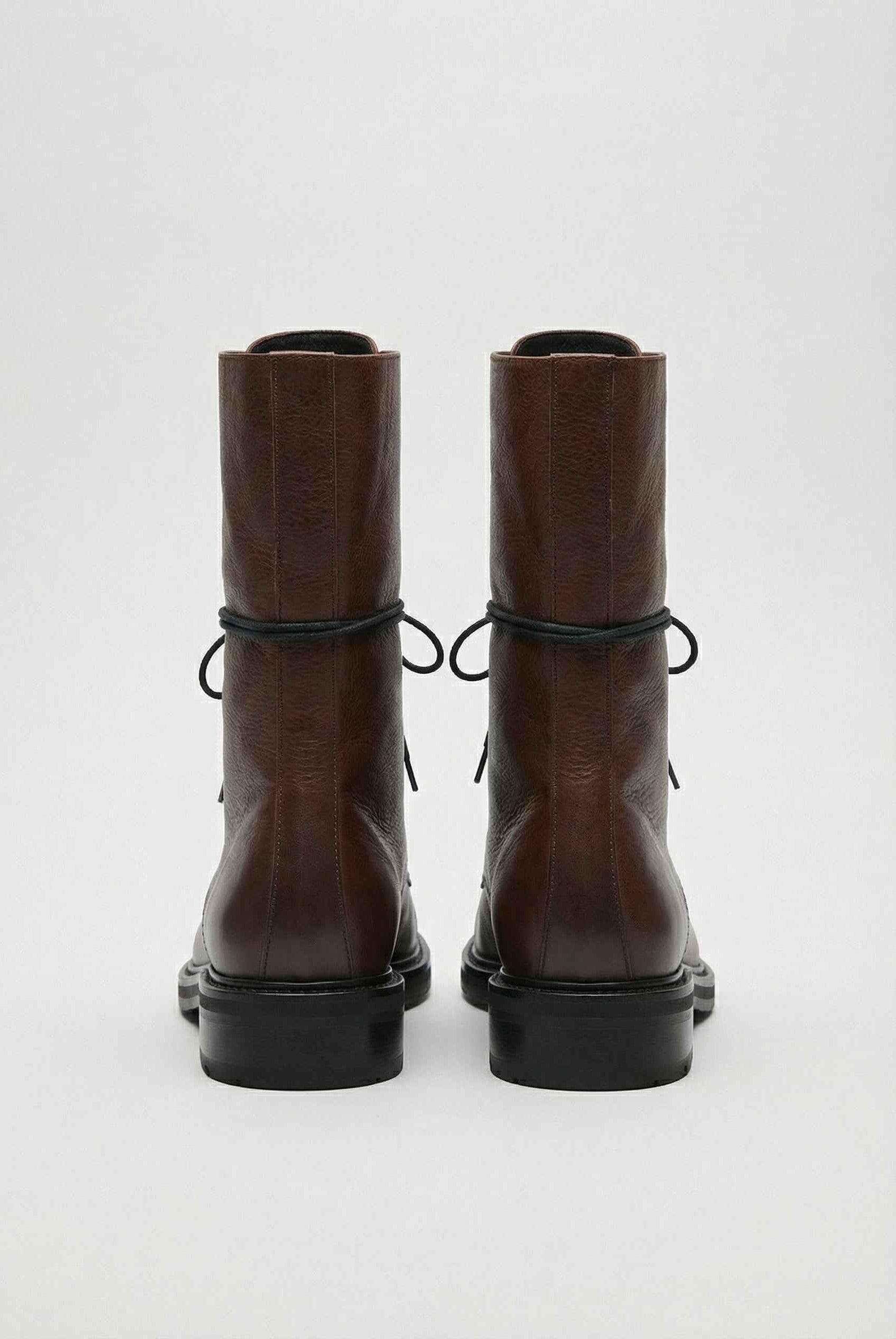 Dark brown Lumina Wear Victoria lace-up ankle boots with chic detailing and cozy design, perfect for stylish casual wear.