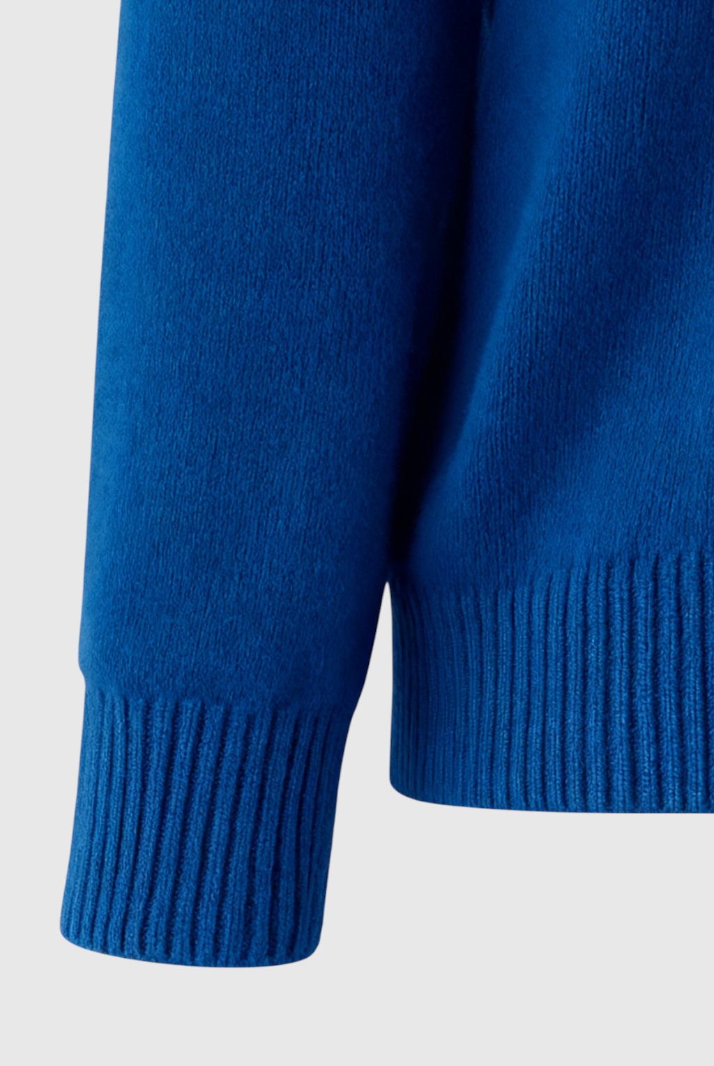 Dark blue Victoria V-neck sweater by Lumina Wear, featuring a cozy fit and flattering silhouette, worn casually.