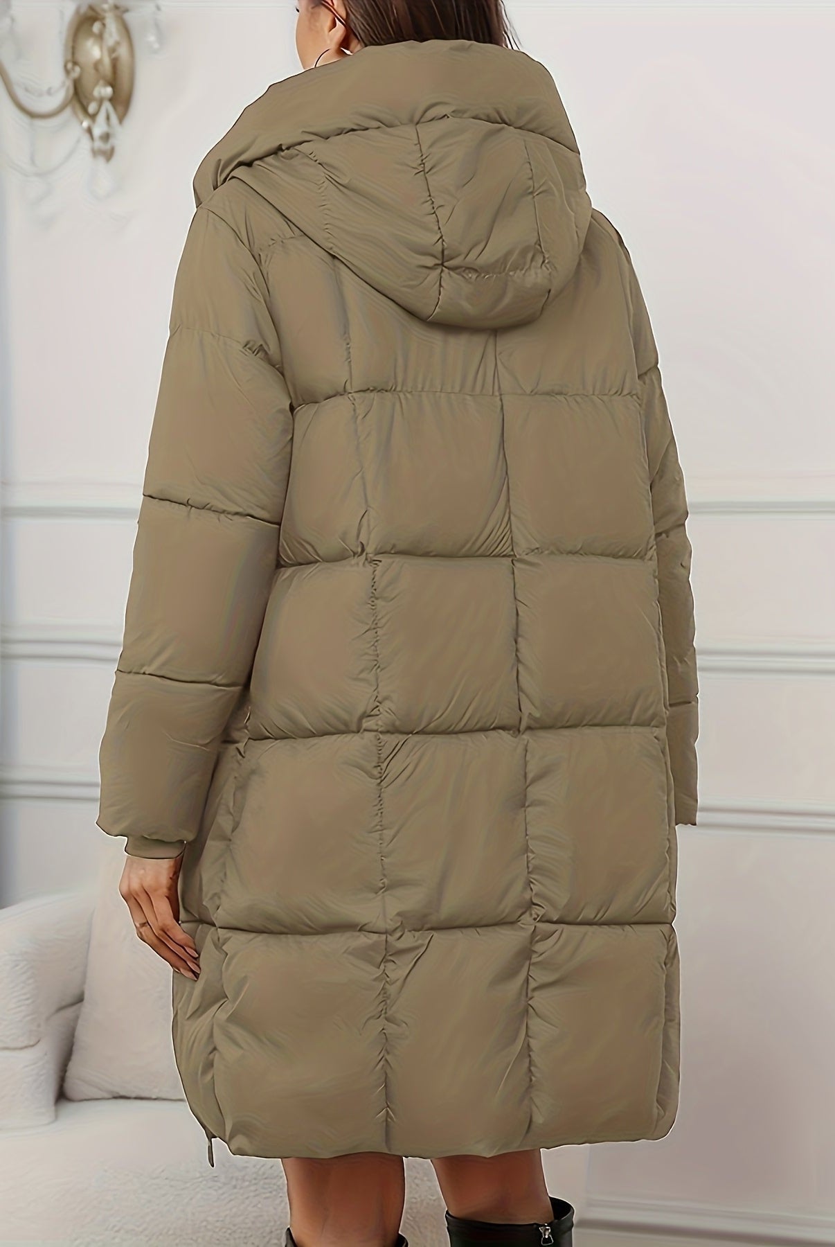 Redish-brown Victoria Lumina Wear longline hooded puffer coat with practical pockets, cozy and insulated for cold weather.