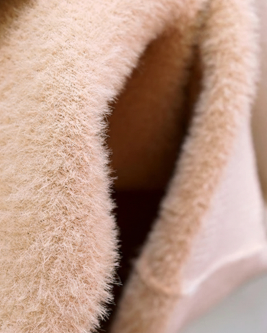 Elegant beige Lumina Wear slim fit turtleneck sweater for winter, shown on a model with a cozy, stylish fit.
