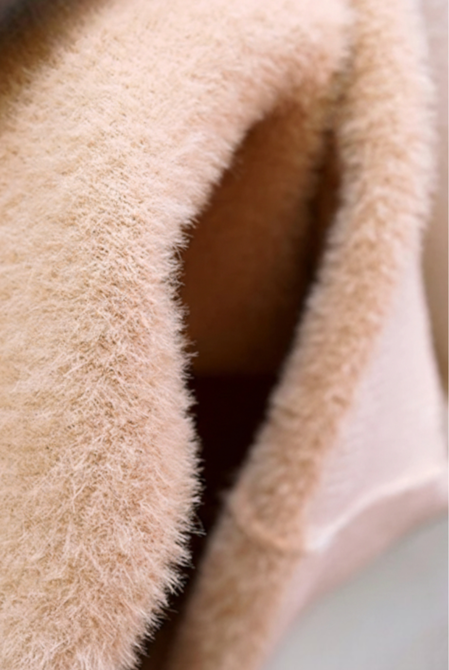 Elegant beige Lumina Wear Victoria slim fit turtleneck sweater for winter, shown on a model highlighting its cozy fit and stylish design.