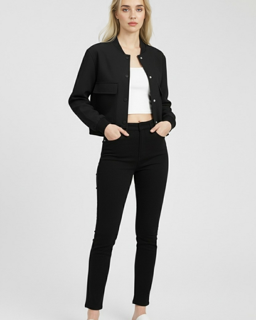 Elegant black bomber jacket by Lumina Wear featuring a timeless design, showcased on a model with stylish details.