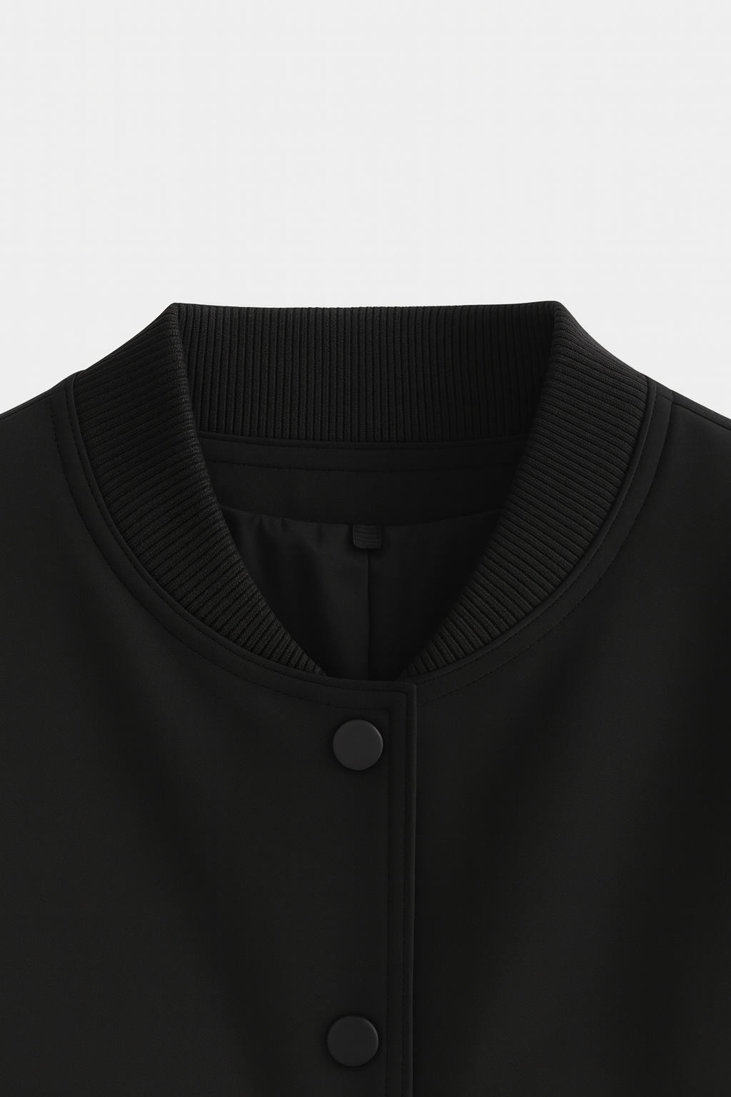 Elegant black bomber jacket from Lumina Wear featuring a timeless design, shown on a model with a modern urban background.
