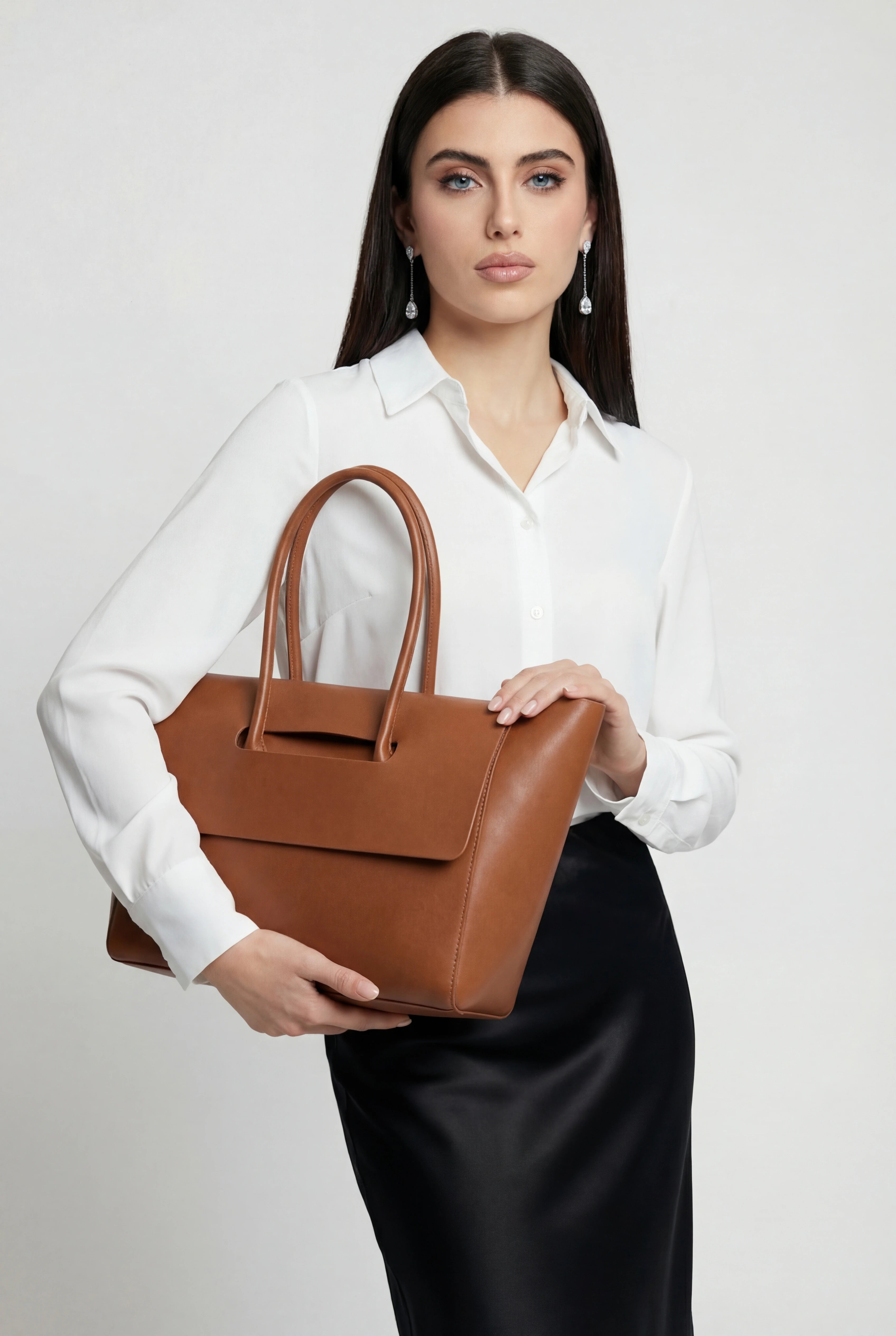 Elegant black Lumina Wear Victoria handbag with adjustable strap, stylish and versatile for daily or evening use.