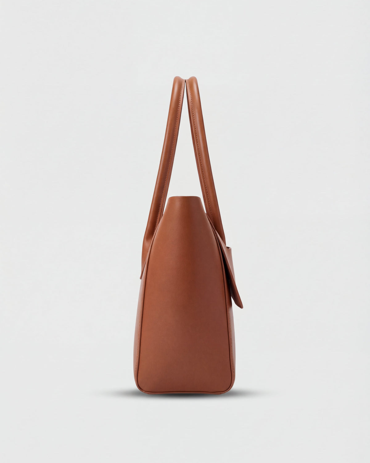 Elegant black Lumina Wear handbag with adjustable strap, featuring a sleek design and stylish accents for versatile use.
