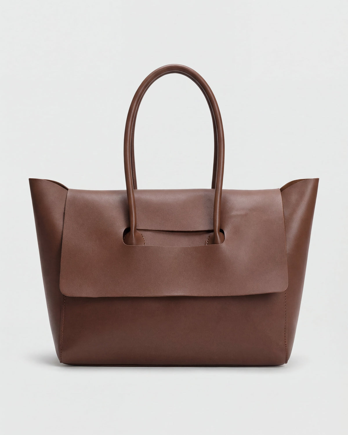 Elegant black Lumina Wear Victoria handbag with adjustable strap, featuring sleek design and top handle for versatile style.