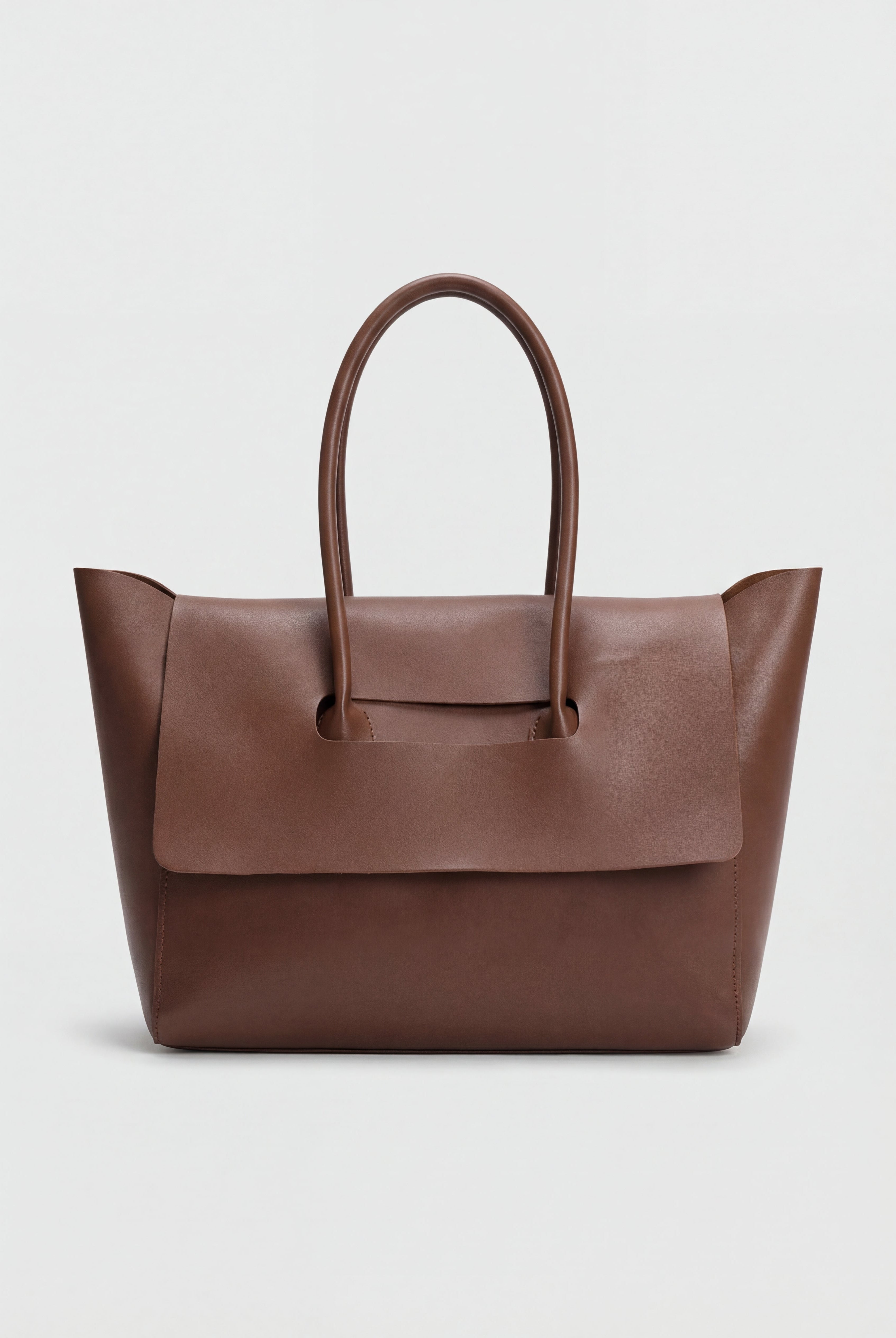 Elegant black Lumina Wear handbag with adjustable strap, featuring sleek design and silver-tone hardware.