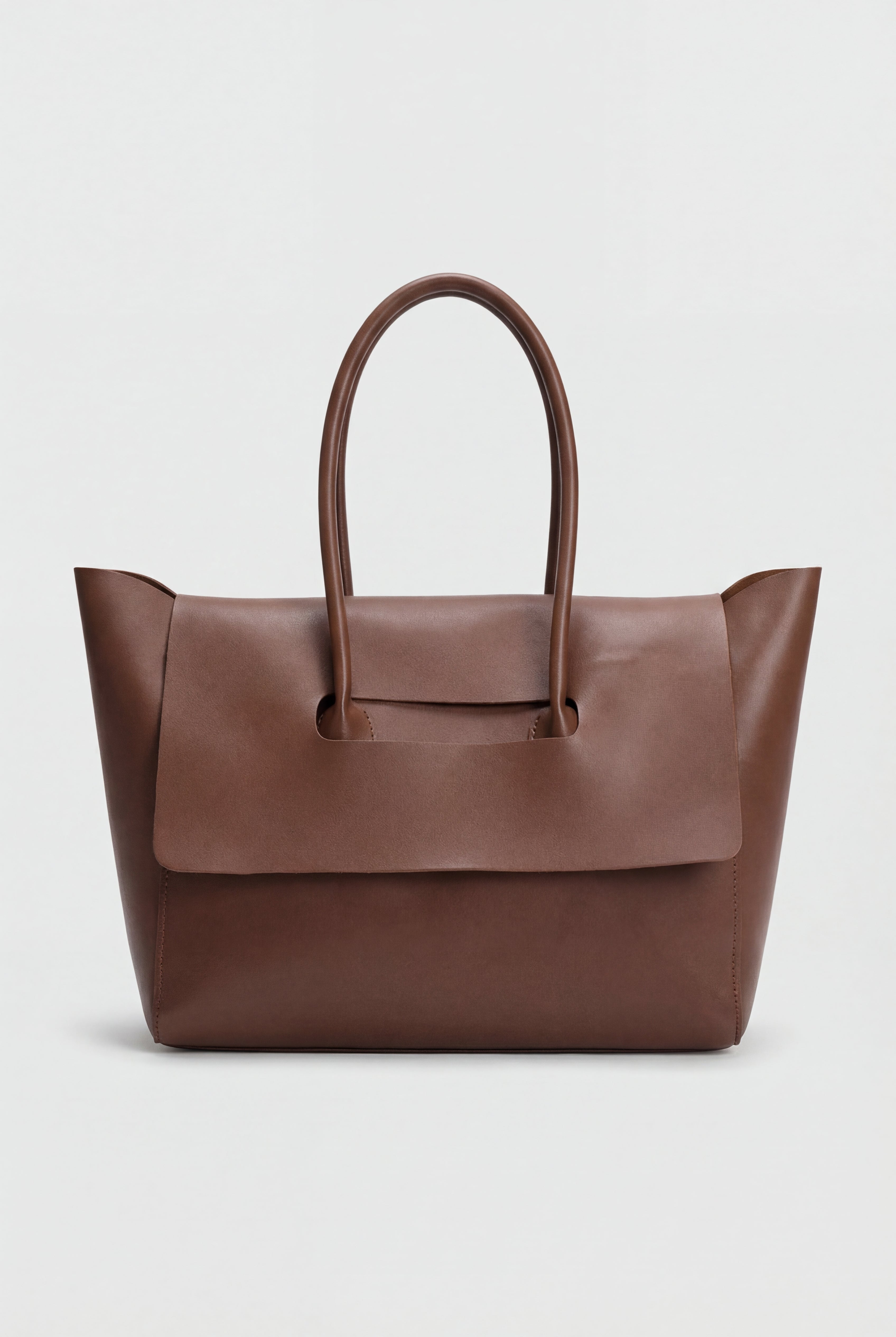 Elegant black Lumina Wear handbag with adjustable strap, featuring sleek design and silver-tone hardware.