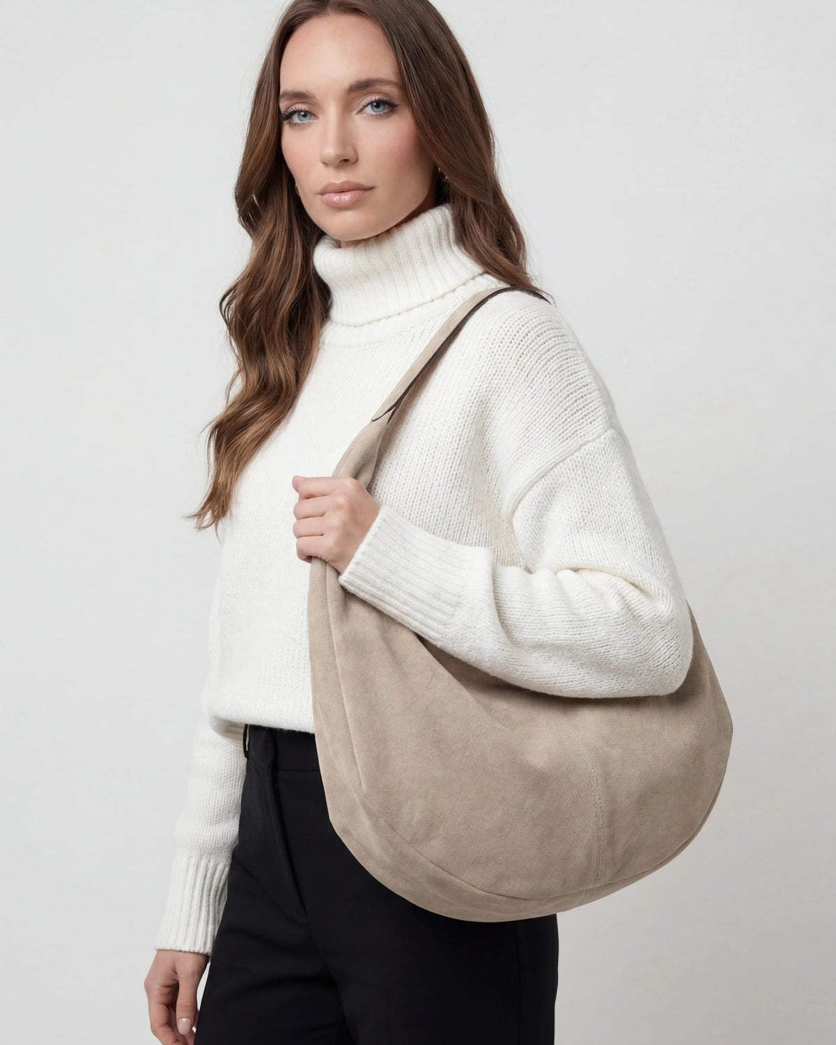 Elegant black suede Lumina Victoria hobo handbag with multiple pockets, stylish and spacious for everyday use.