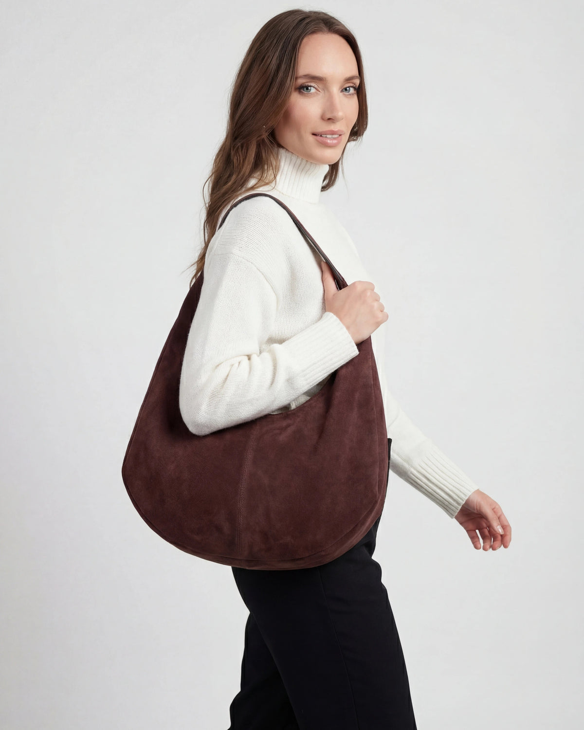 Elegant black suede hobo handbag with multiple pockets from Lumina Wear, showcasing a stylish and functional design.
