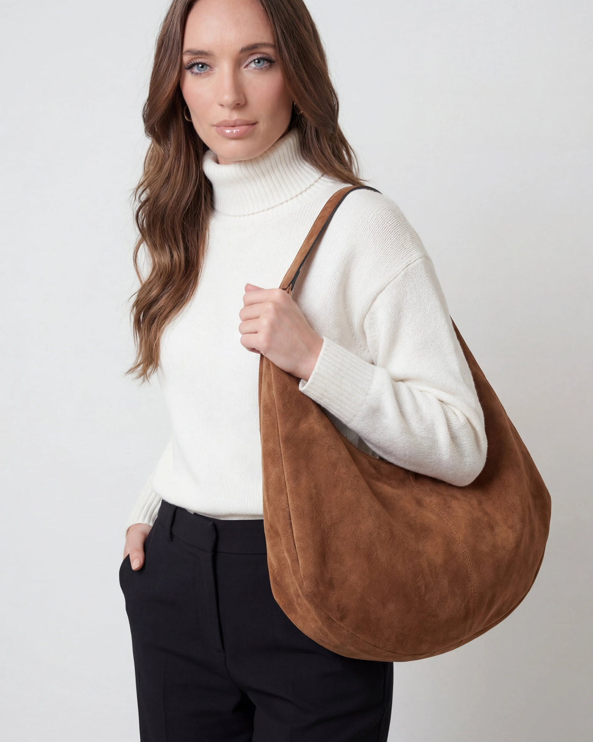 Lumina Wear Victoria black suede hobo handbag with multiple pockets and elegant design, showcasing its stylish and functional features.
